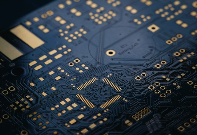 Image of a of a CPU, with gold colored soldering giving it a luxurious look. Represents the fantasy CPU be build in this blog post.